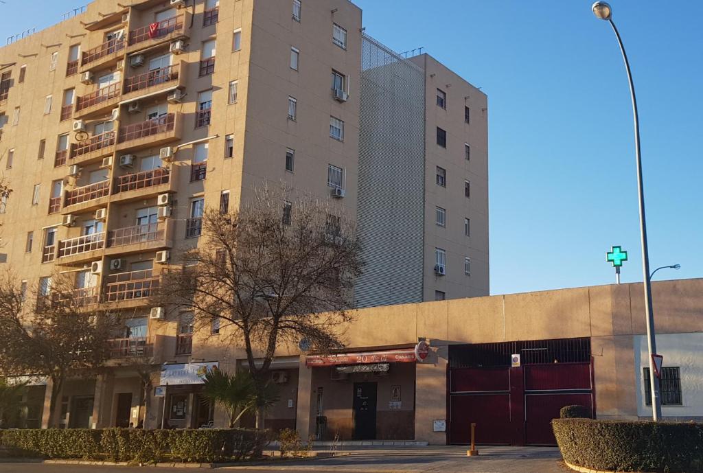 a large apartment building with a building at Apartamento frente a Palacio de Congresos (Fibes) in Seville