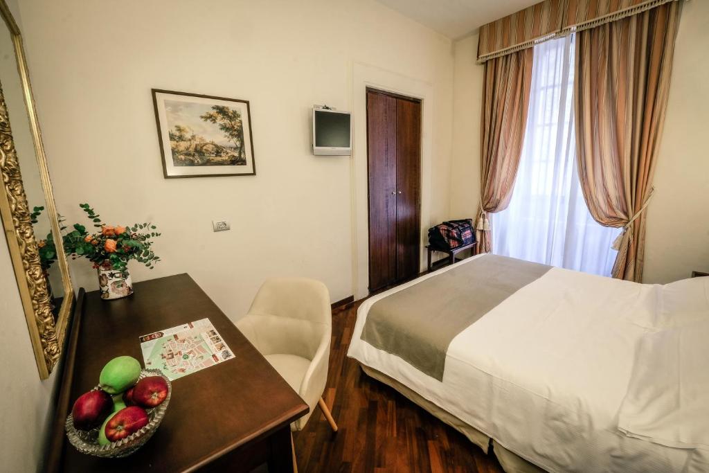 Postel nebo postele na pokoji v ubytování Bosone Palace