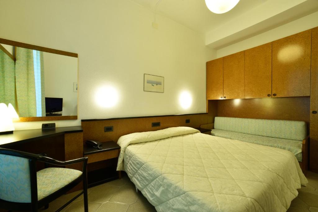 Кровать или кровати в номере Hotel Lamberti