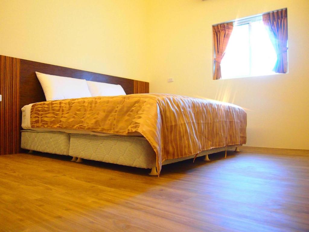 Postel nebo postele na pokoji v ubytování Jia's Homestay