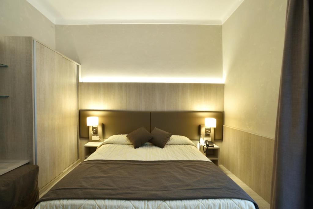 Кровать или кровати в номере Hotel Lamberti
