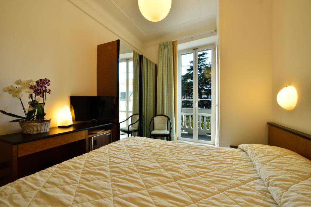 Кровать или кровати в номере Hotel Lamberti