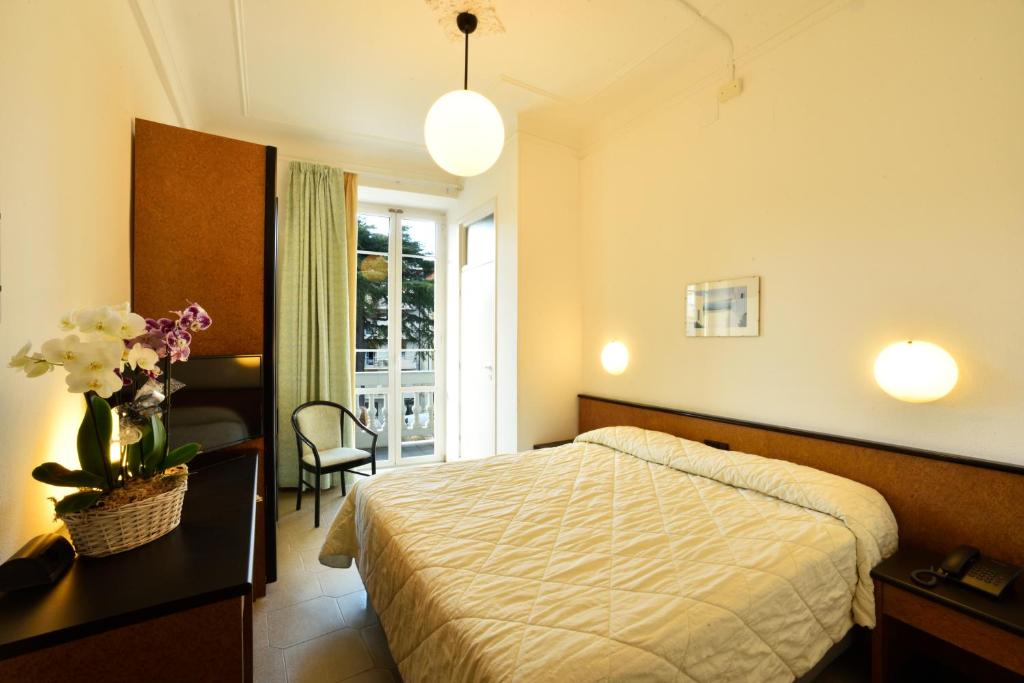 Кровать или кровати в номере Hotel Lamberti