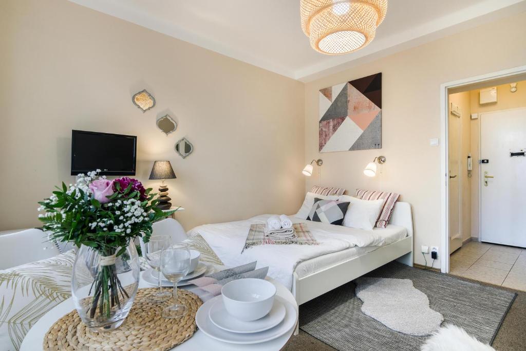 a living room with a white couch and a table at Old Town Studio Apartment in Prague