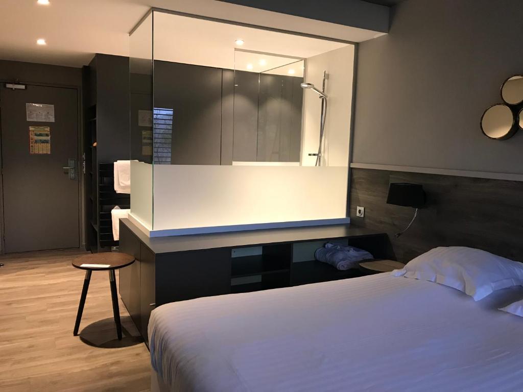 Postel nebo postele na pokoji v ubytování Hotel Restaurant Perle Des Vosges