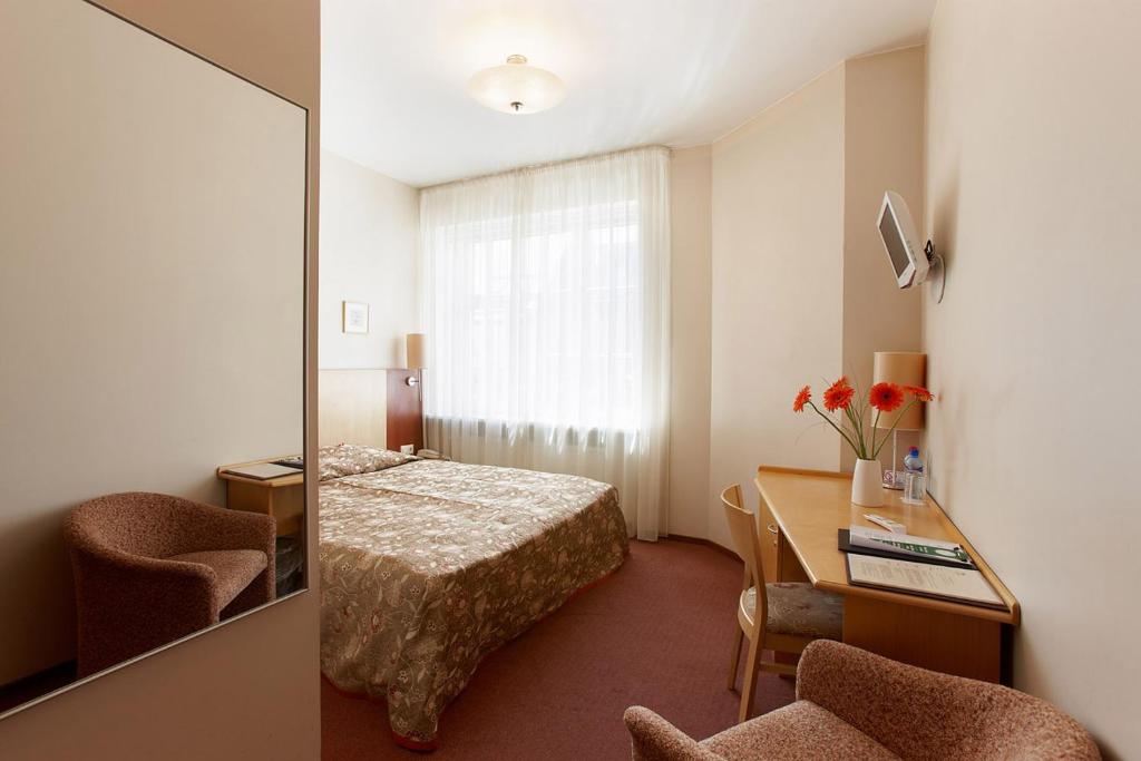 Postel nebo postele na pokoji v ubytování Hotel Edvards