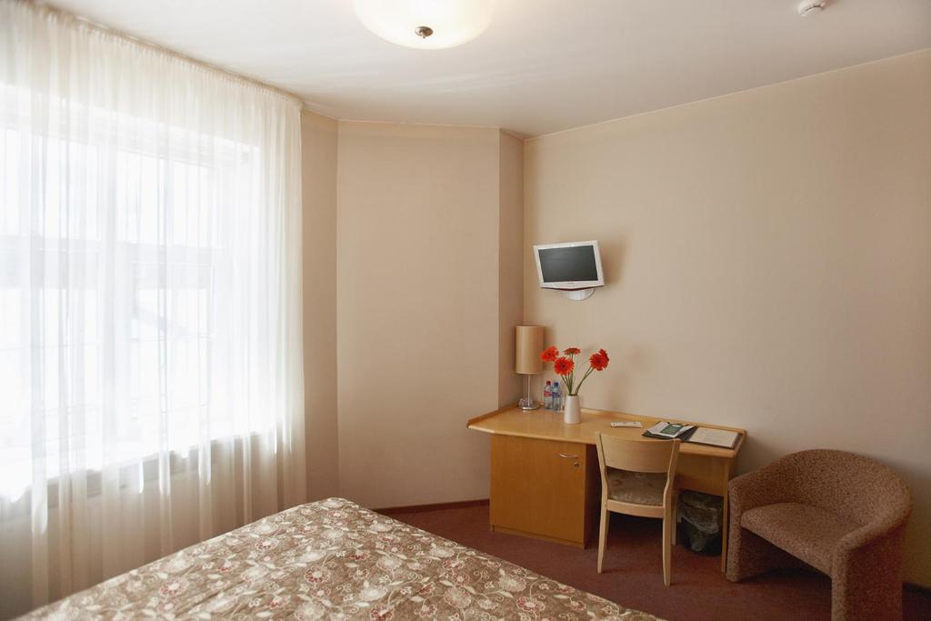 Postel nebo postele na pokoji v ubytování Hotel Edvards