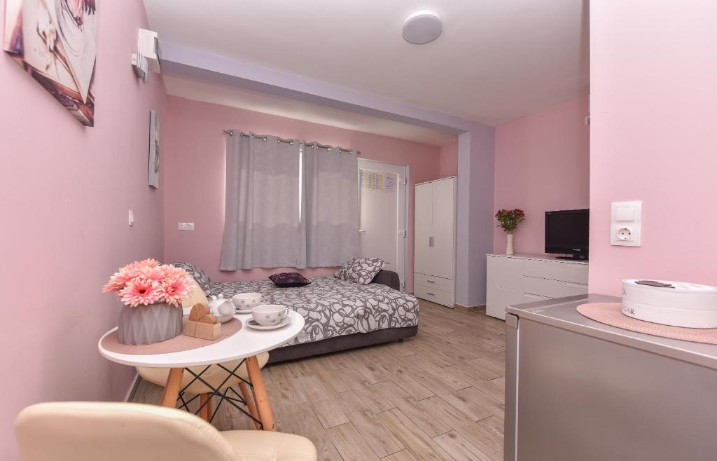 Postel nebo postele na pokoji v ubytování Studio Apartment Deluxe