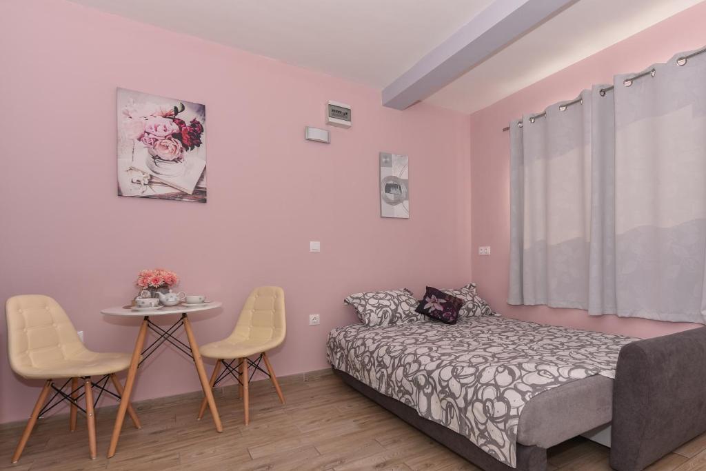 Postel nebo postele na pokoji v ubytování Studio Apartment Deluxe