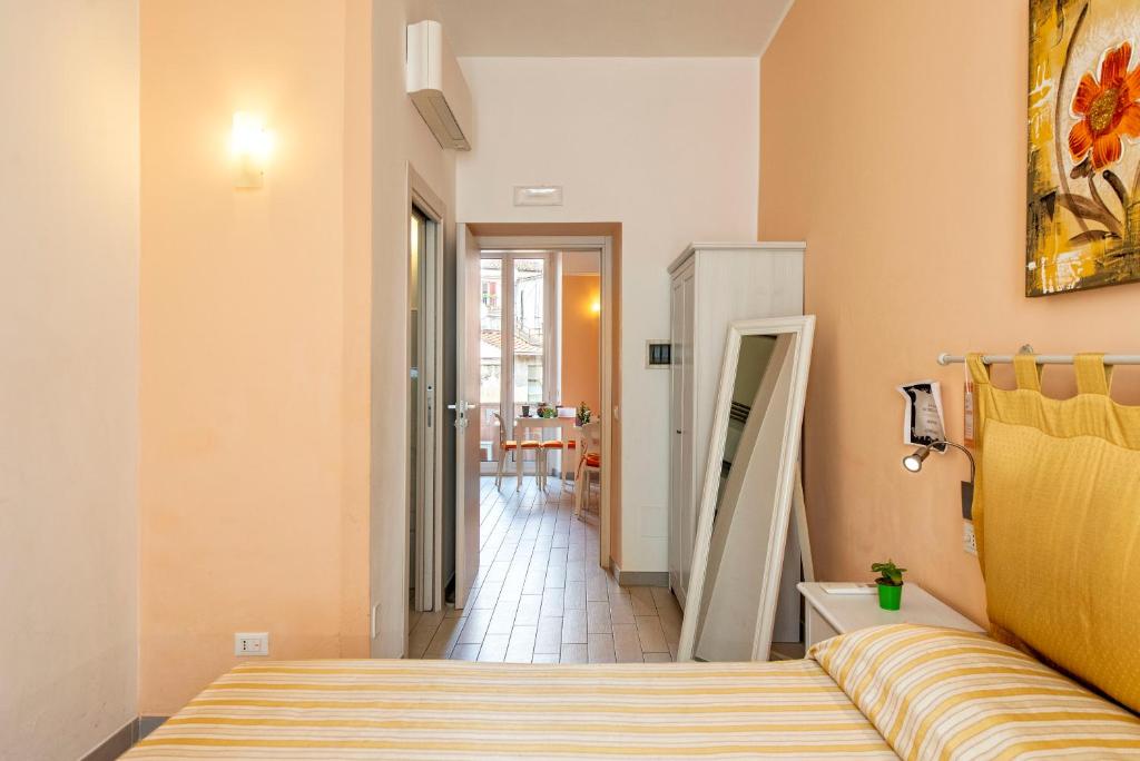A bed or beds in a room at Merulana Suite 2