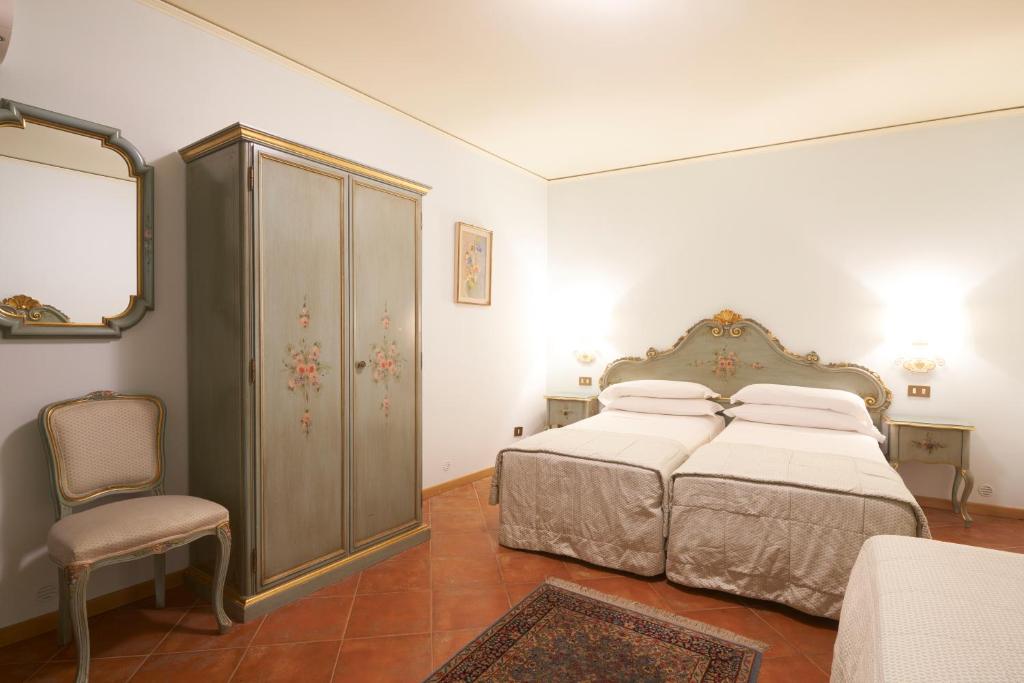 Postel nebo postele na pokoji v ubytování Hotel Serenissima