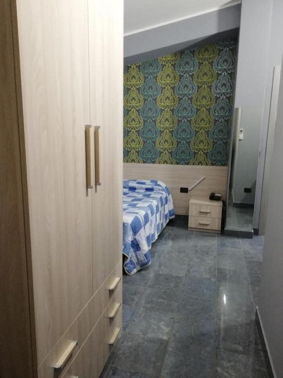 A bed or beds in a room at Motel Kratos