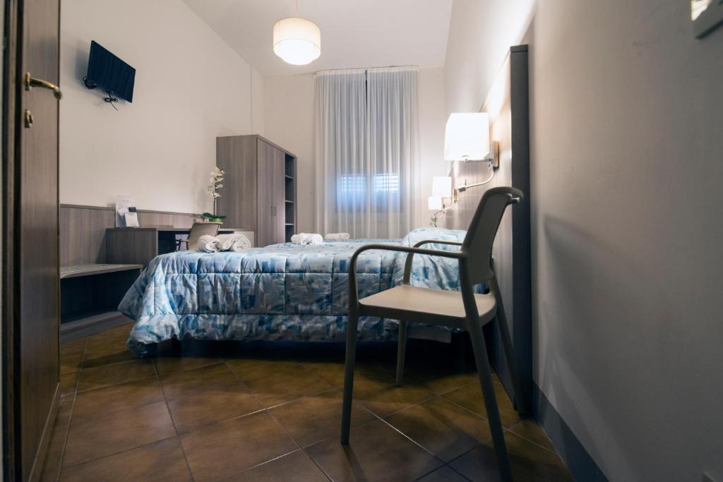 Postel nebo postele na pokoji v ubytování Foresteria Valdese di Firenze