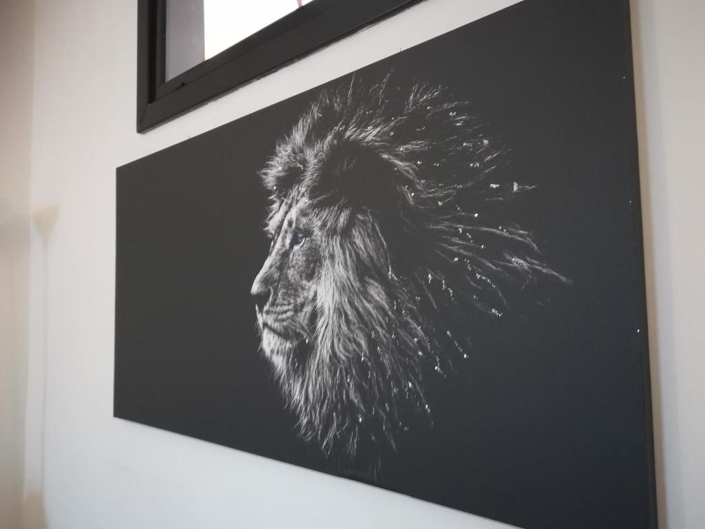 a black and white picture of a lion at Appartamento il Leone in Empoli