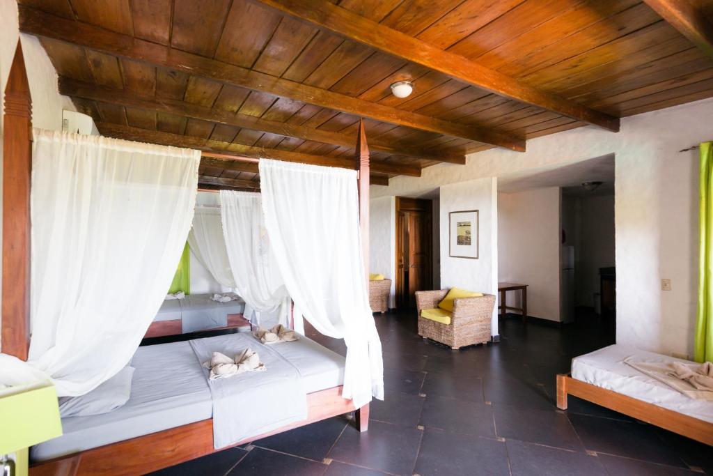 Postel nebo postele na pokoji v ubytování Punta Duarte Garden Inn