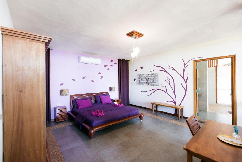 Postel nebo postele na pokoji v ubytování Punta Duarte Garden Inn