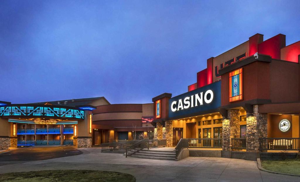 a casino building at night with lights on at Ute Mountain Casino Hotel in Towaoc