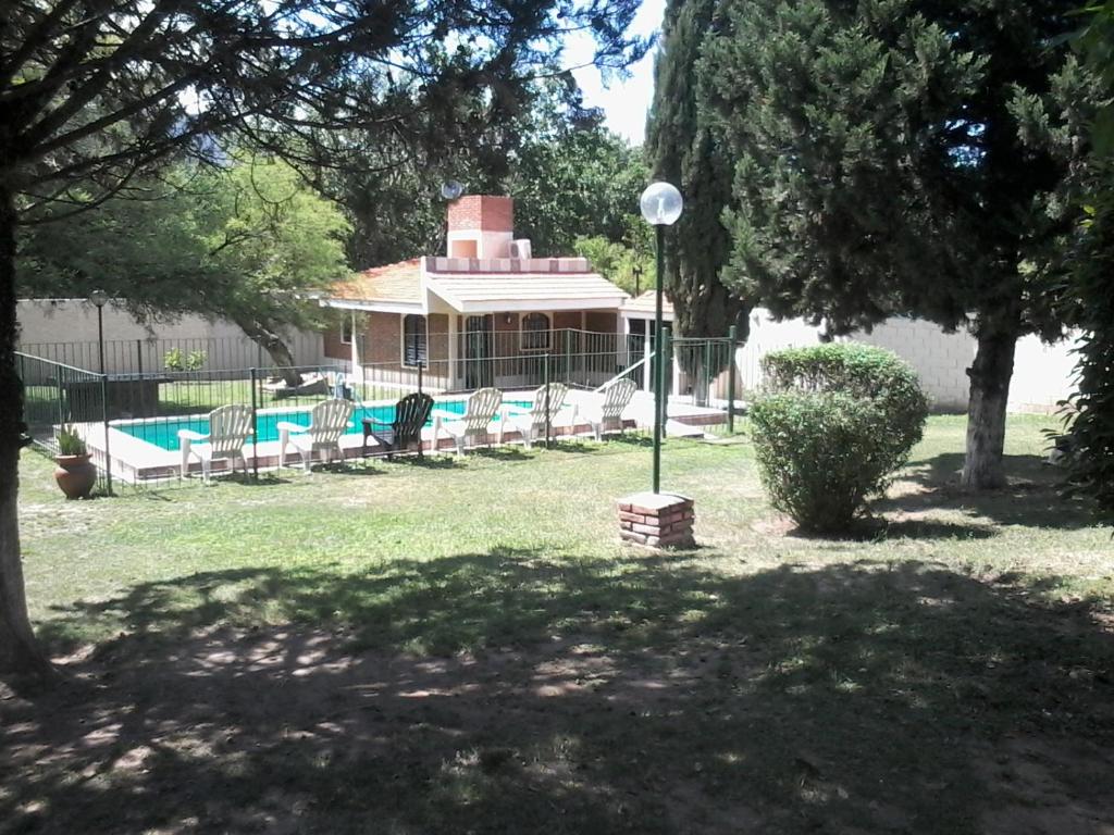 a house with a swimming pool in a yard at La Casa de Ana in Bialet Massé