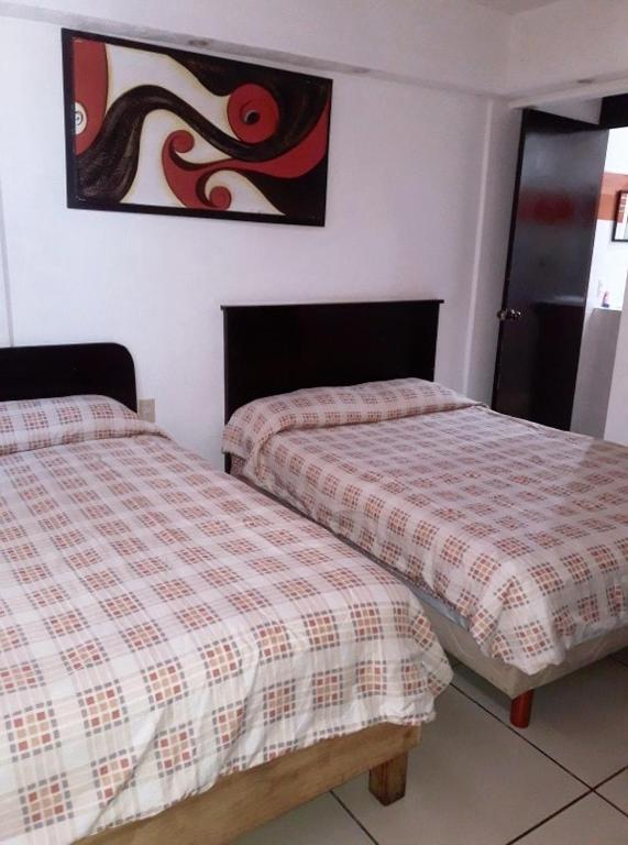 Postel nebo postele na pokoji v ubytování Hotel Marina Campeche