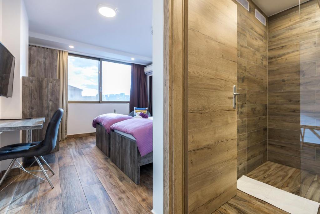 Posteľ alebo postele v izbe v ubytovaní Apinelo Tower Rooms
