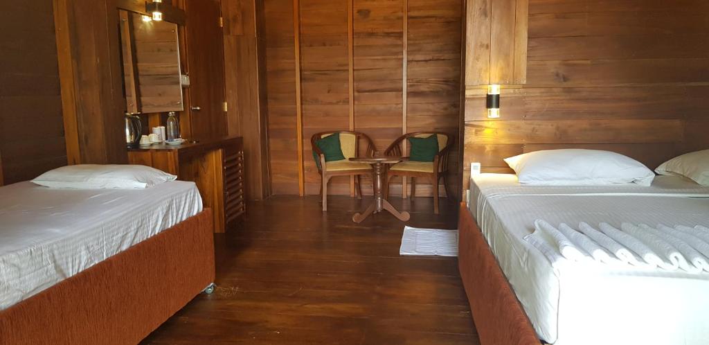 Postel nebo postele na pokoji v ubytování Wilpattu Tree House