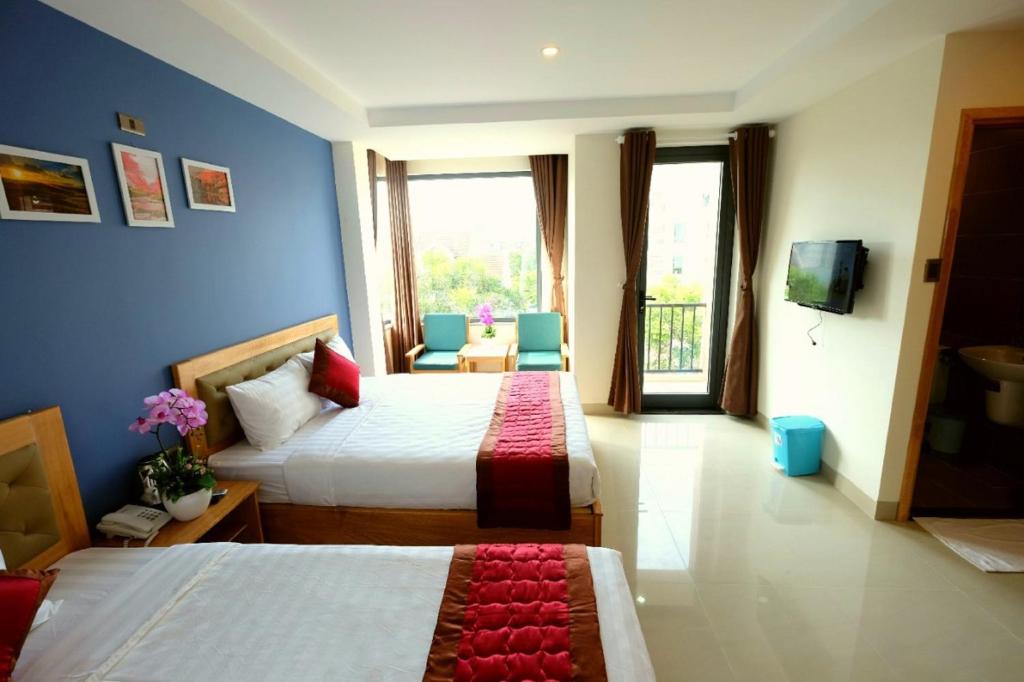 Marigold Hotel & Apartment - Family Room With Balcony