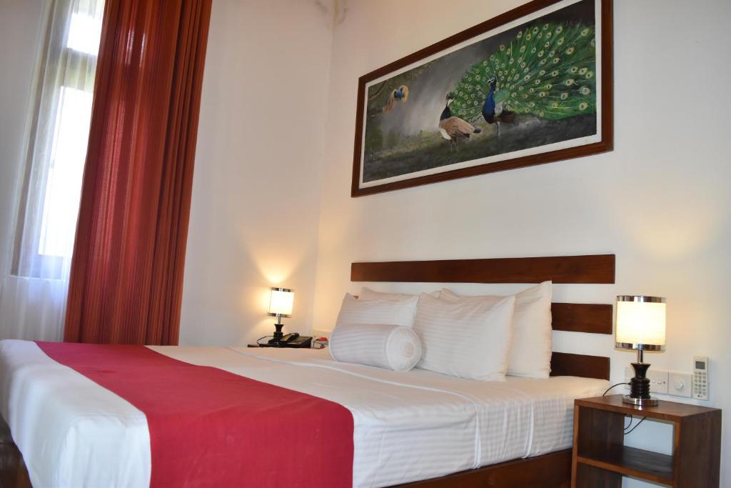 Postel nebo postele na pokoji v ubytování Sigiri Asna Nature Resort