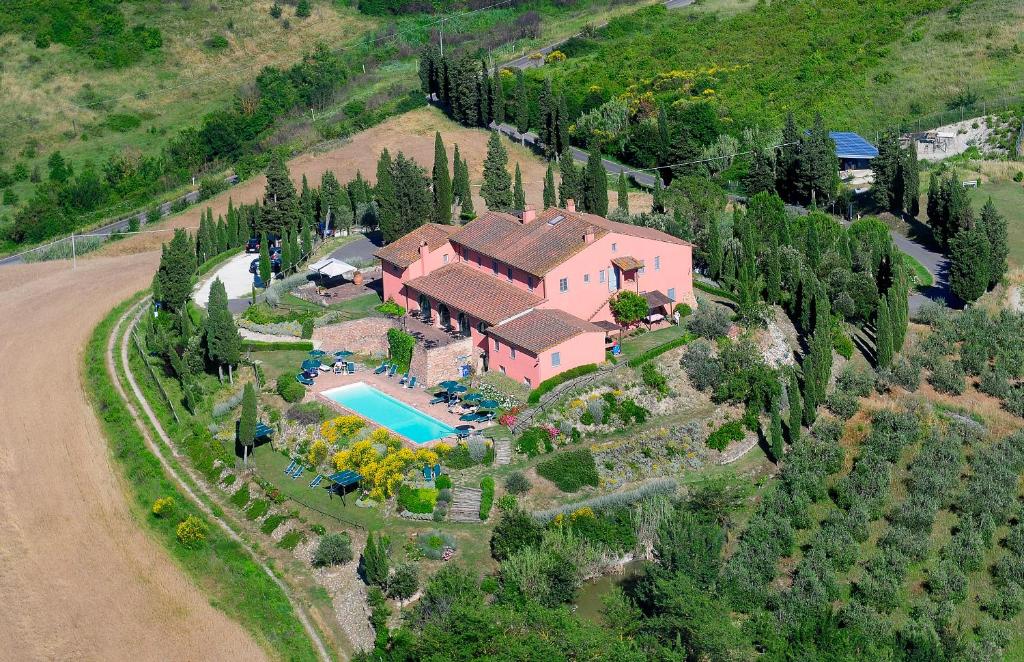 an aerial view of a house with a swimming pool at Podere Benintendi in Certaldo