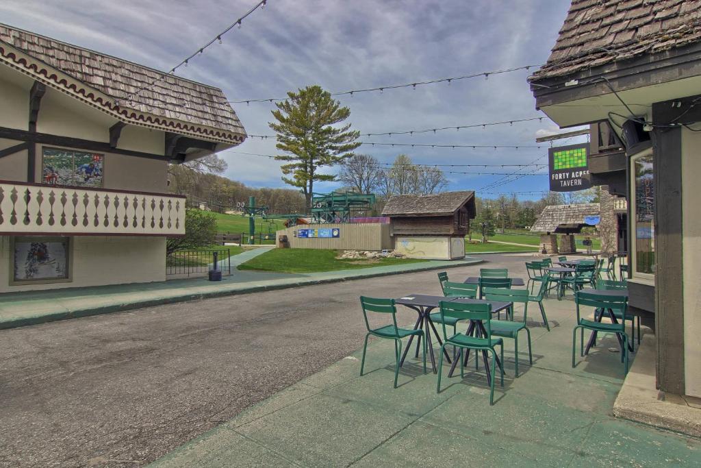a group of tables and chairs on the side of a street at 620 Disciples Village in Boyne Falls