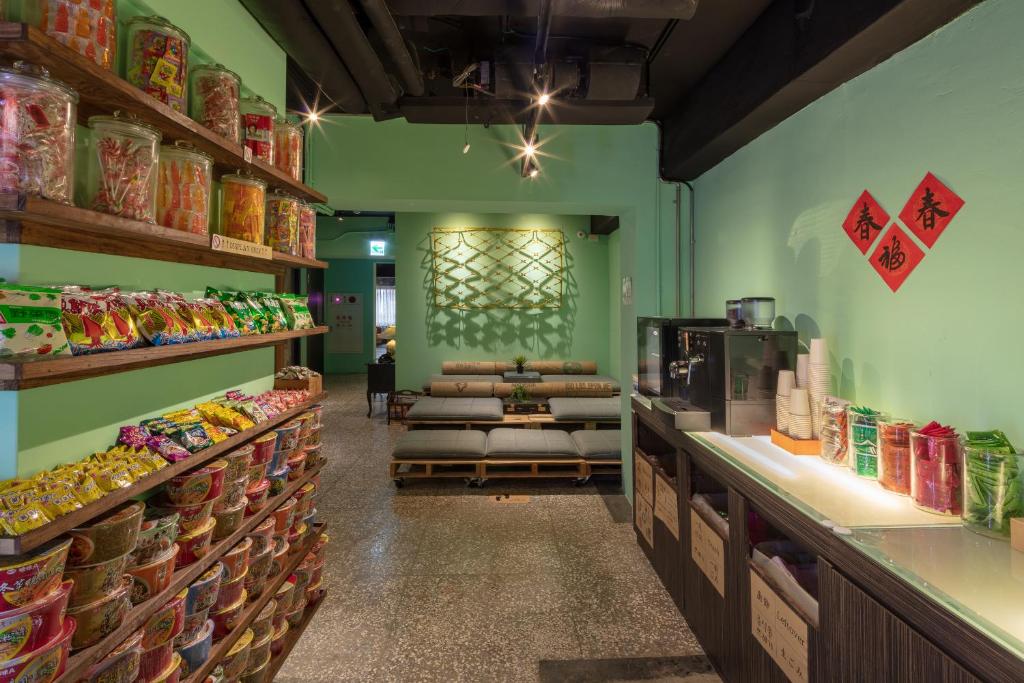 a grocery store with a aisle with food on shelves at Cho Hotel in Taipei