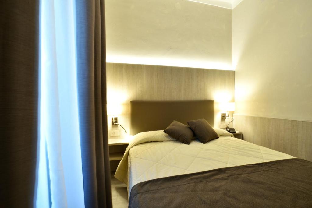 Кровать или кровати в номере Hotel Lamberti