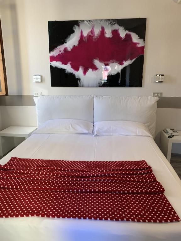 Postel nebo postele na pokoji v ubytování Albergo Al Cacciatore Tortellinando