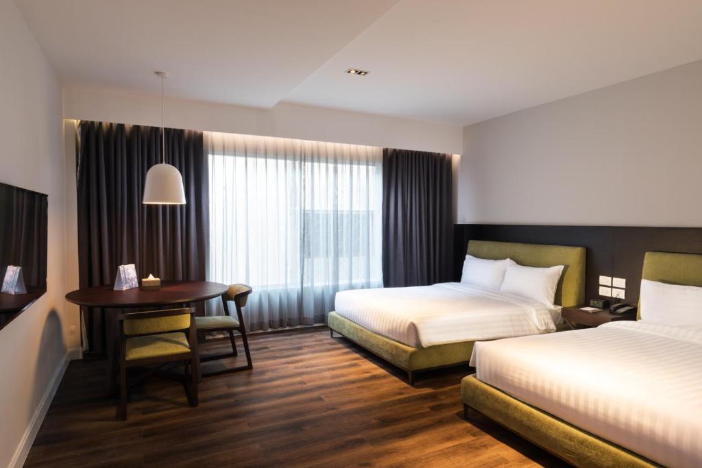 Postel nebo postele na pokoji v ubytování S Ram Leisure Hotel SHA PLUS