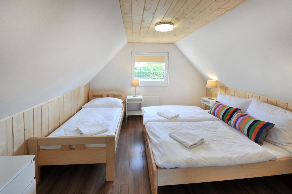 Postel nebo postele na pokoji v ubytování APLEND Chaty Tatry Holiday