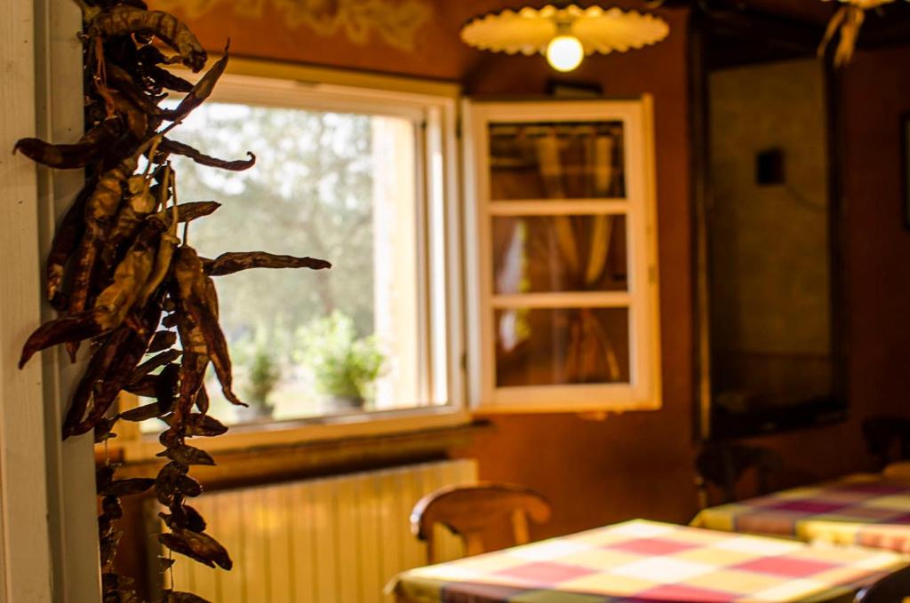 Posteľ alebo postele v izbe v ubytovaní Bio Agriturismo Il Melograno di Banditella Ristorante