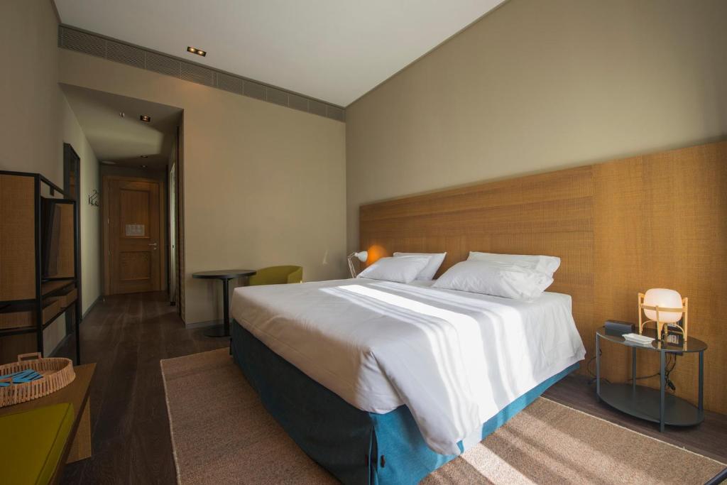Postel nebo postele na pokoji v ubytování Grand Hotel Billia