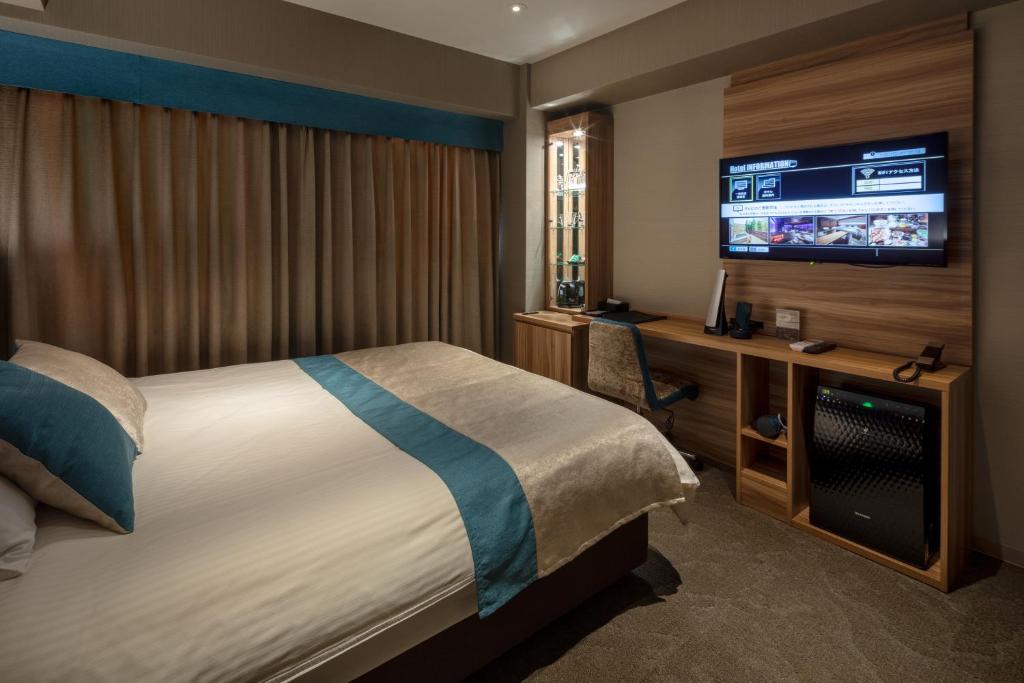 Postel nebo postele na pokoji v ubytování Wat Hotel & Spa Hida Takayama