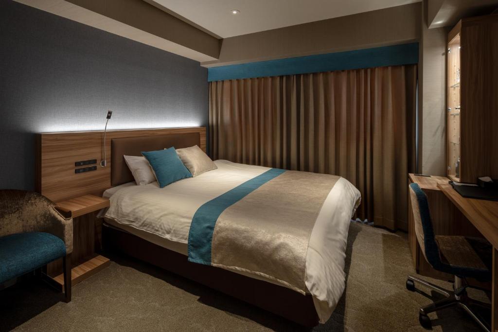 Postel nebo postele na pokoji v ubytování Wat Hotel & Spa Hida Takayama