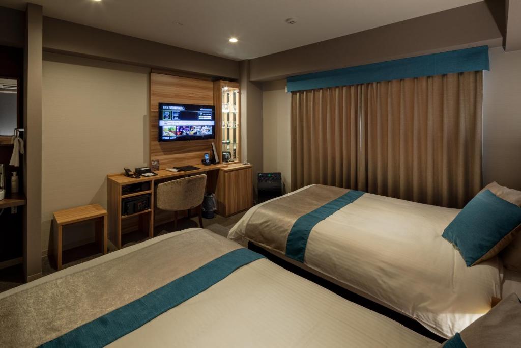 Postel nebo postele na pokoji v ubytování Wat Hotel & Spa Hida Takayama