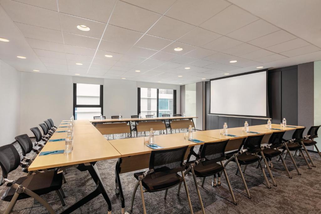 A large conference room arranged for a presentation or meeting.