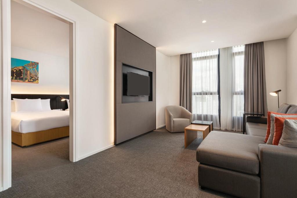 A suite-style sitting area opening directly onto a separate bedroom.