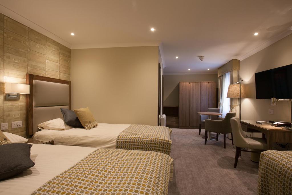 Postel nebo postele na pokoji v ubytování Cruachan Hotel