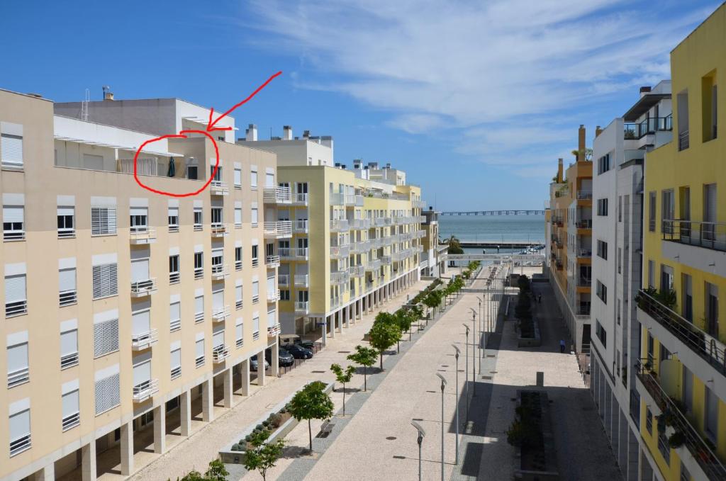 a building with a red circle in the middle of a street at Expo Marina Lis in Lisbon