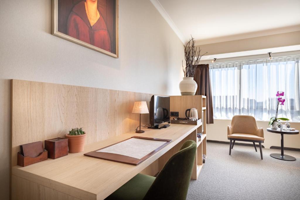 TV a/nebo společenská místnost v ubytování Hotel Carlton