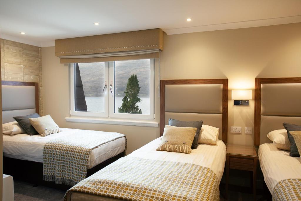 Postel nebo postele na pokoji v ubytování Cruachan Hotel