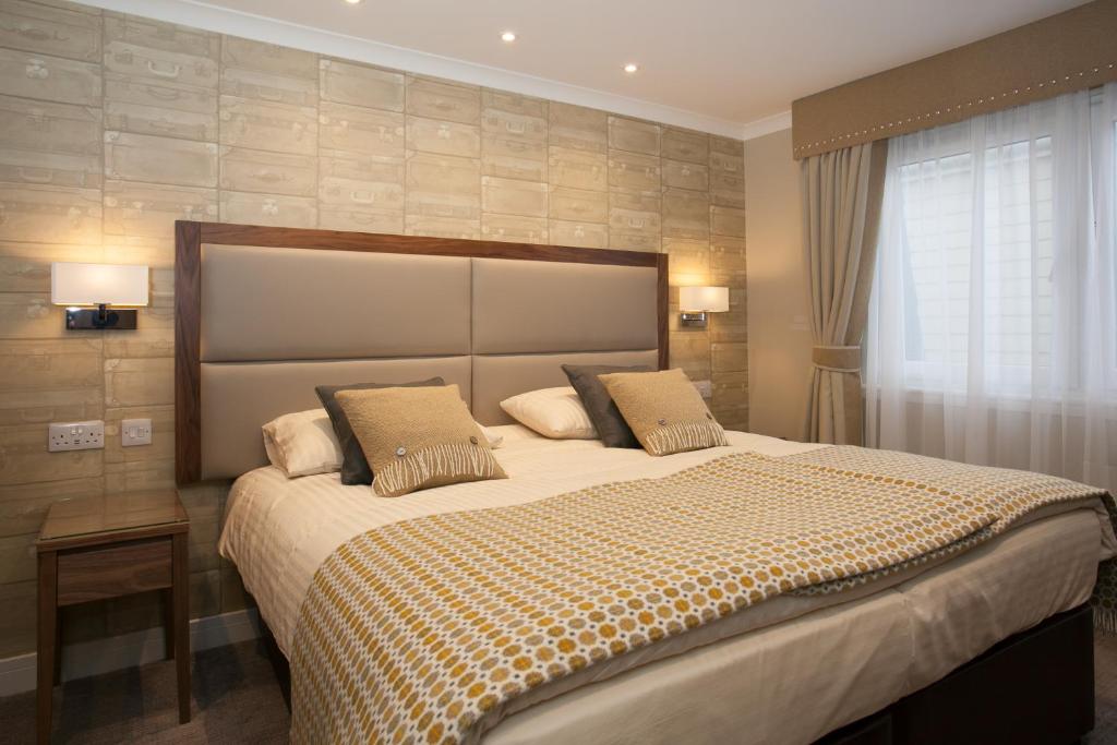 Postel nebo postele na pokoji v ubytování Cruachan Hotel