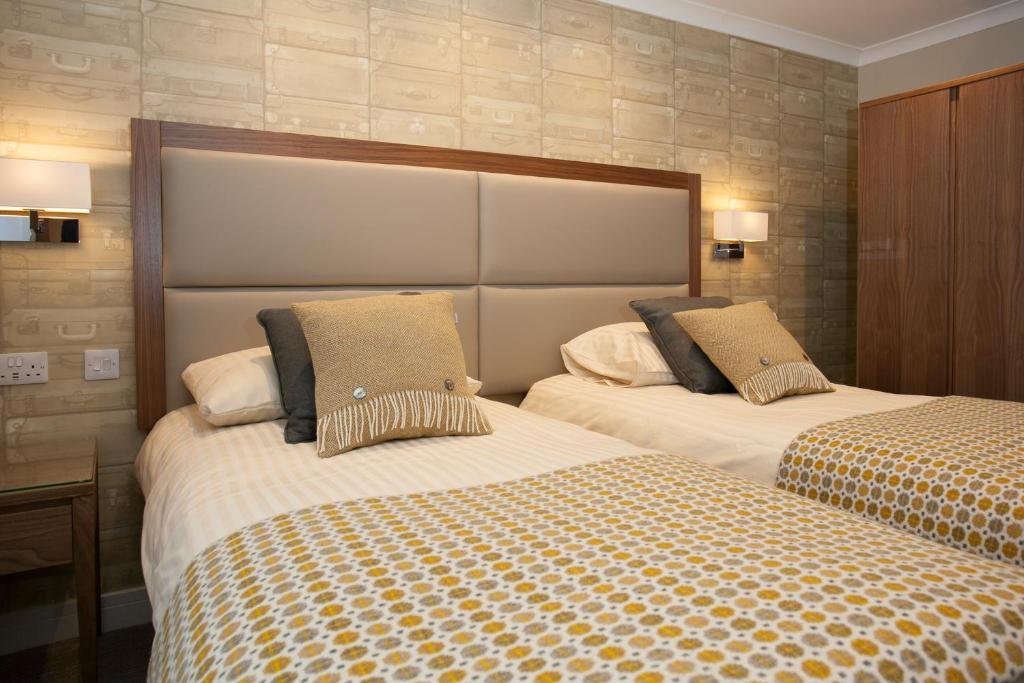 Postel nebo postele na pokoji v ubytování Cruachan Hotel