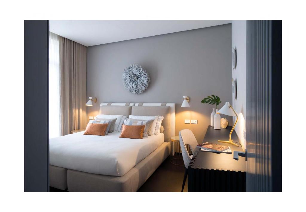 Postel nebo postele na pokoji v ubytování Hotel Byron
