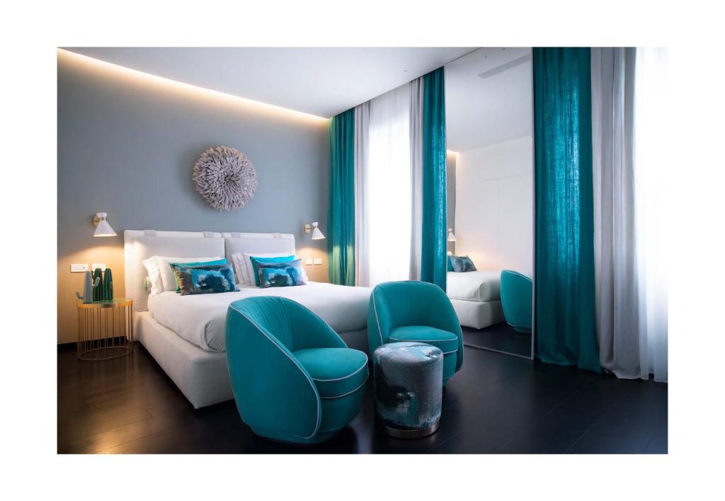 Postel nebo postele na pokoji v ubytování Hotel Byron