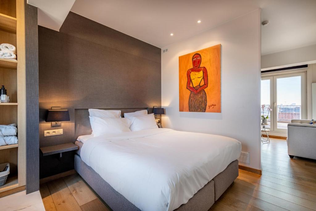 Postel nebo postele na pokoji v ubytování Hotel Carlton